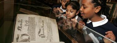 children looking at the interactive book