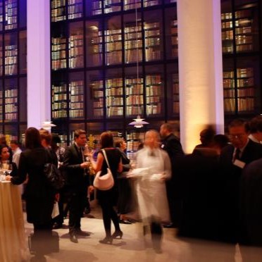 A group of people stand in the foyer of the British Library 