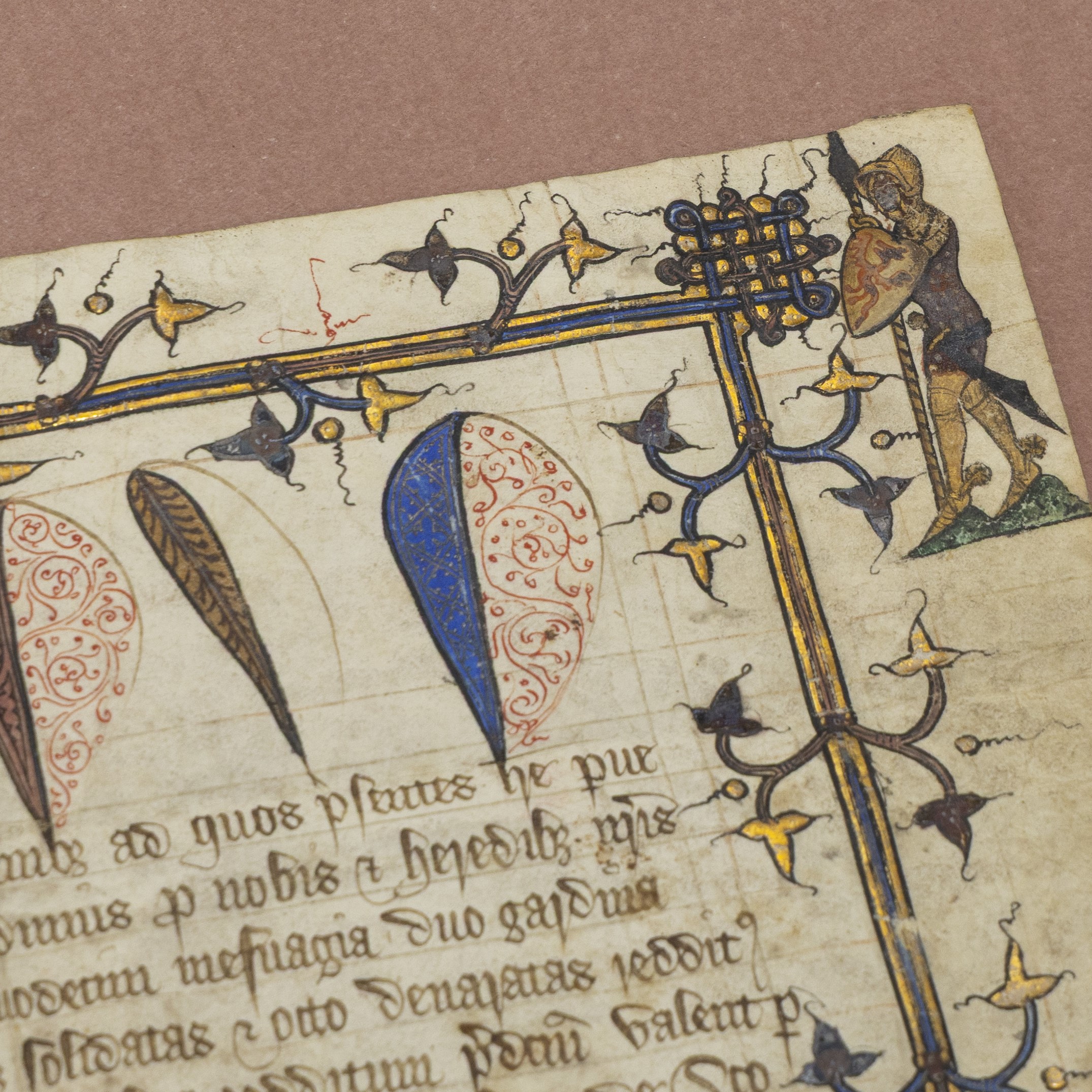 A close-up image of an illuminated charter, the corner of which is showing Goliath