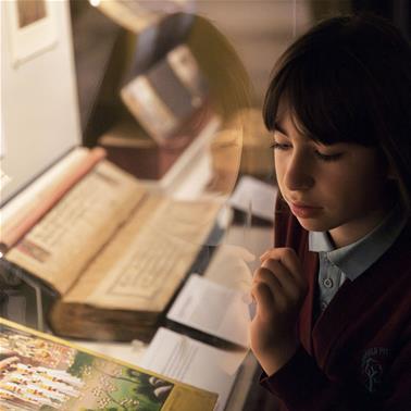 A child looks at an item in our Treasures Gallery