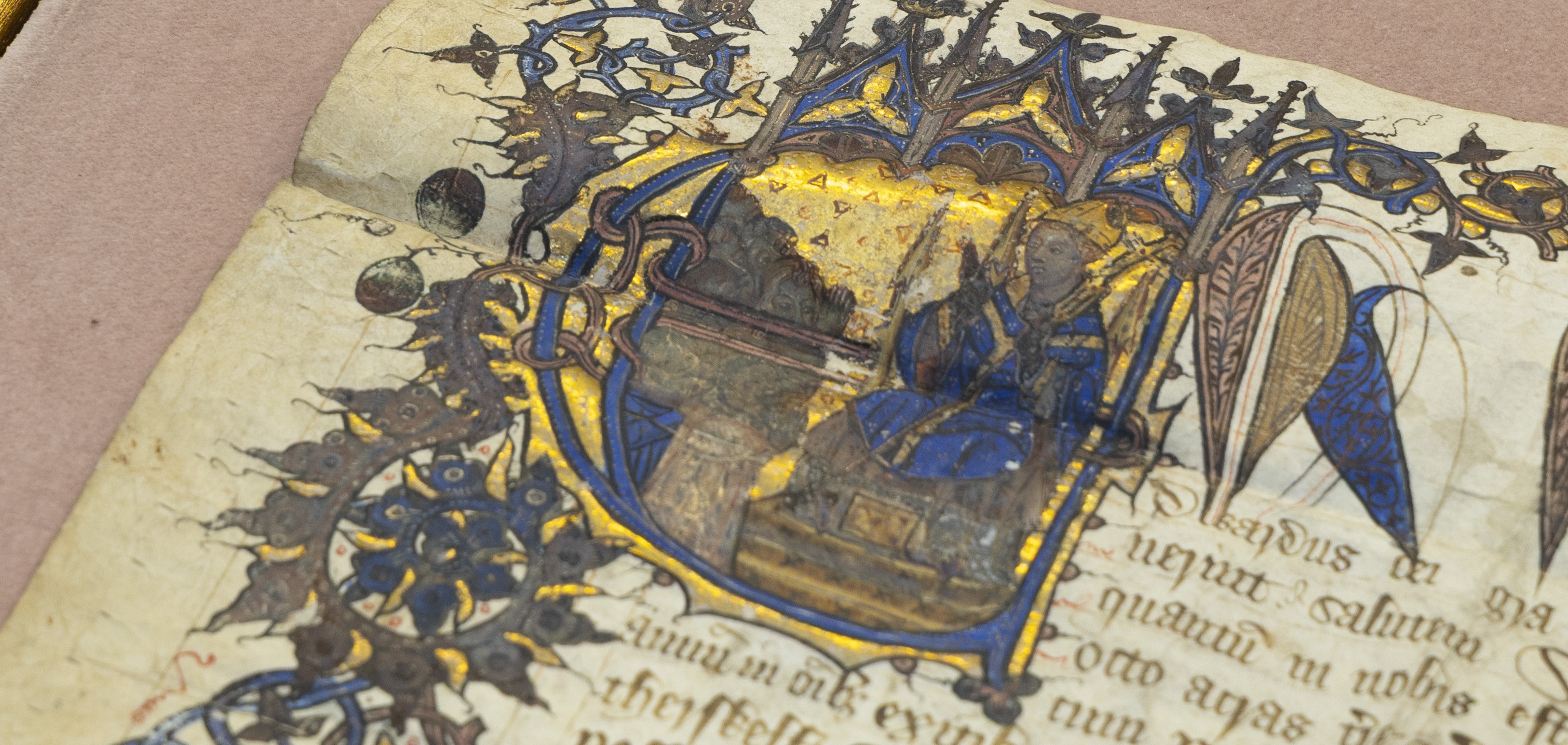 An up-close image of an illimated manuscript, with gold 